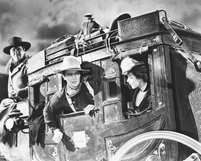 Louise Platt در صحنه فیلم سینمایی Stagecoach به همراه John Wayne و George Bancroft