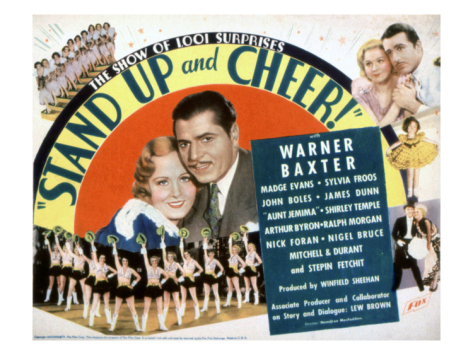 Warner Baxter در صحنه فیلم سینمایی Stand Up and Cheer! به همراه James Dunn، Sylvia Froos، Madge Evans، John Boles و Shirley Temple