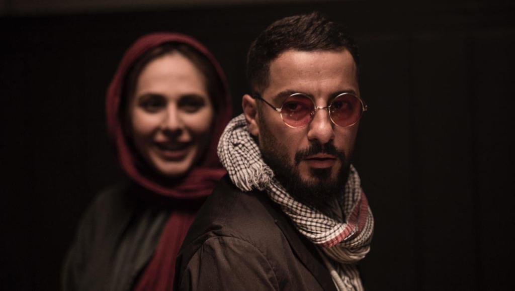 نوید محمدزاده در صحنه فیلم سینمایی خشم و هیاهو به همراه رعنا آزادی‌ور