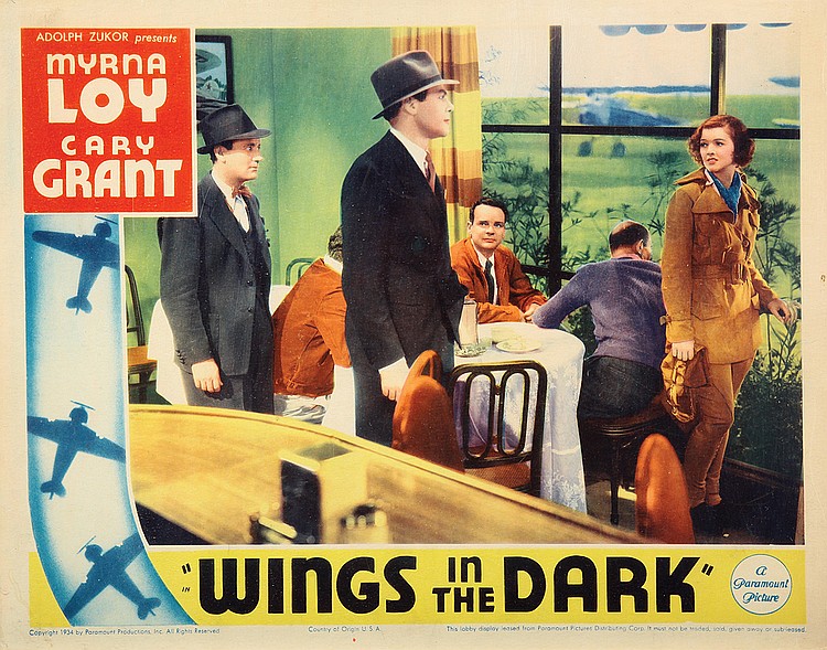 Russell Hopton در صحنه فیلم سینمایی Wings in the Dark به همراه Roscoe Karns، میرنا لوی و کری گرانت