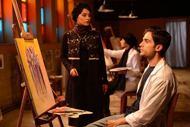 آرمان درویش در صحنه فیلم سینمایی کمدی انسانی به همراه بهاره کیان‌افشار
