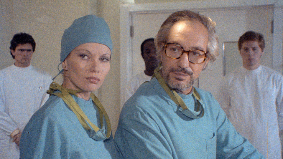 Walter Patriarca در صحنه فیلم سینمایی Zombie Holocaust به همراه Alexandra Delli Colli