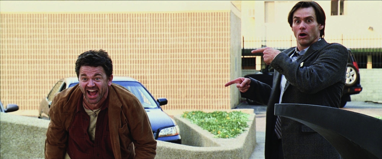 جیم کری در صحنه فیلم سینمایی Yes Man به همراه John Michael Higgins