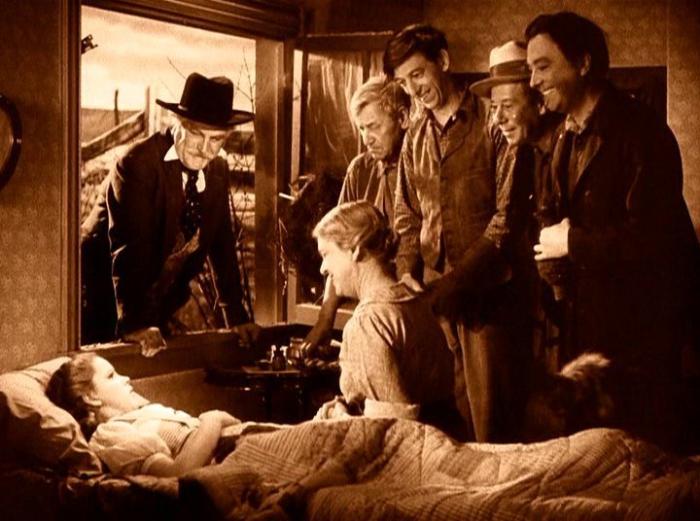 Bert Lahr در صحنه فیلم سینمایی جادوگر شهر آز به همراه جک هالی، کلارا بلندیک، ری بولگر، Terry، فرانک مورگان و جودی گارلند