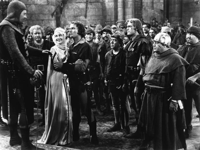 Eugene Pallette در صحنه فیلم سینمایی ماجراهای رابین هود به همراه Alan Hale، Patric Knowles، Ian Hunter، Errol Flynn، Herbert Mundin و Olivia de Havilland